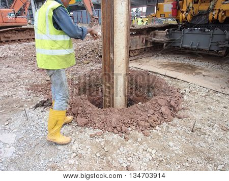 MALACCA, MALAYSIA - MARCH 12, 2015: Bore pile rig machine at the construction site in Malacca, Malaysia. The machine used to driven pile for building foundation work.