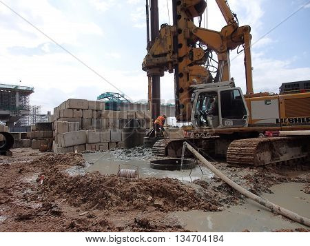 MALACCA, MALAYSIA - MARCH 12, 2015: Bore pile rig machine at the construction site in Malacca, Malaysia. The machine used to driven pile for building foundation work.