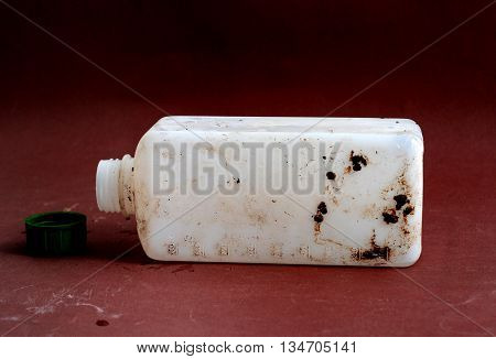 picture of a Dirty Bottle of chemical liquid