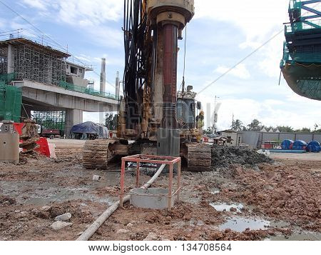 MALACCA, MALAYSIA - MARCH 12, 2015: Bore pile rig machine at the construction site in Malacca, Malaysia. The machine used to driven pile for building foundation work.