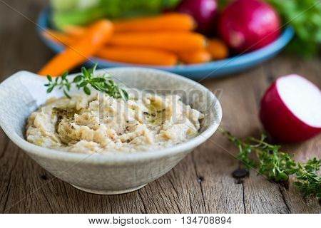 Cannellini beans dip with baby carrotcelery and radish