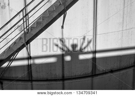 People Shadows On Old Metal Tanks In Power Plant,