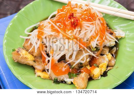'Bot Chien' Fried rice flour cake with eggs, Vietnamese street food in Ho Chi Minh city.