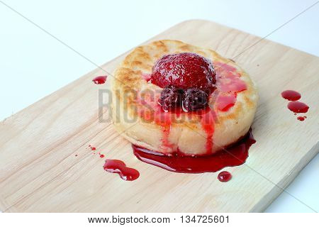 English Crumpets & Berry Topping On Wood Board Isolate On White Background