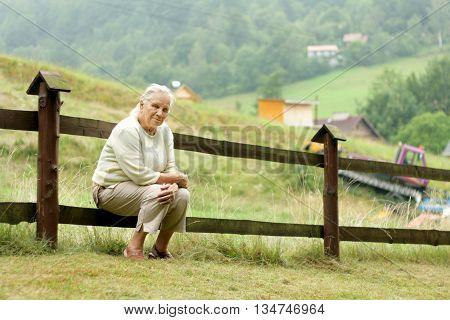 Portrait of senior woman realxing in a garden
