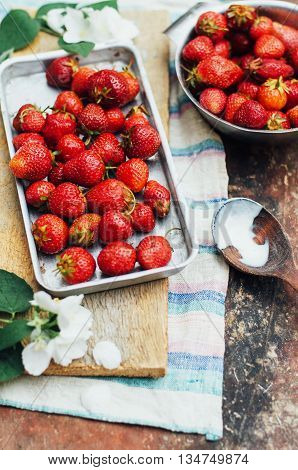 Fresh  Ripe Strawberries And Yellow Cherries Laid Out On The Dis