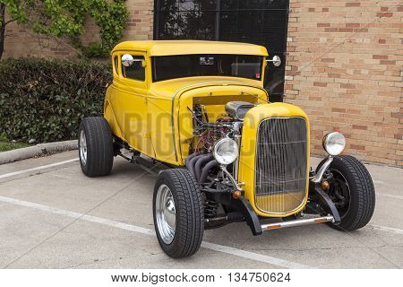 DALLAS USA - APR 9: Yellow hotroad based on the vintage 1932 Ford Coup model. April 9 2016 in Dallas Texas United States