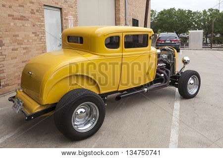 DALLAS USA - APR 9: Yellow hotroad based on the vintage 1932 Ford Coup model. April 9 2016 in Dallas Texas United States