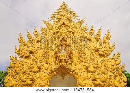 The gold unique architecture at the Wat Rong Khun temple at Chiang Rai, Thailand.