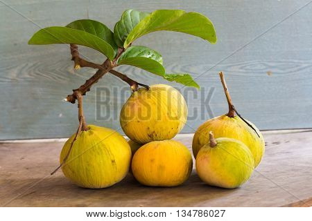 Santol Fruit On Wooden Background,yellow Santol With Green Leaf's Santon