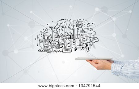 Businessman hand demostrating business strategy plan on tablet screen