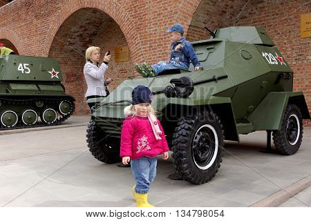 Nizhny Novgorod, Russia - May 3.2013. Children playing on the armored car BA-64 at exhibition of military equipment of times of World War II in the Kremlin of Nizhny Novgorod.