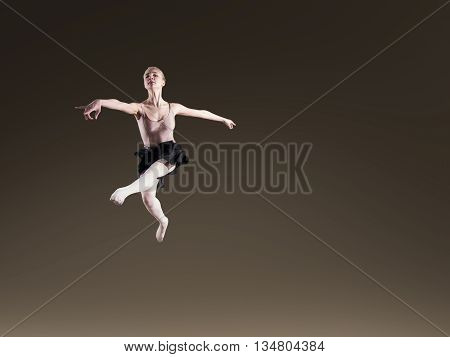 Young beautiful ballerina on dark background in studio