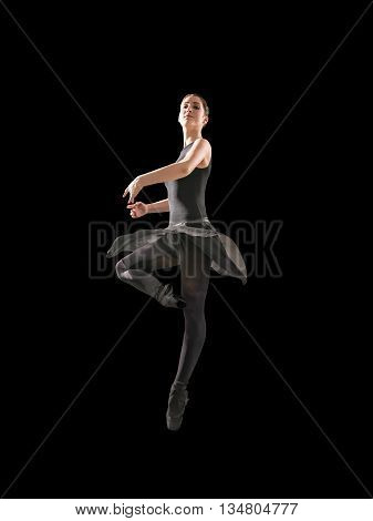 Young woman makes exercise isolated on gray background