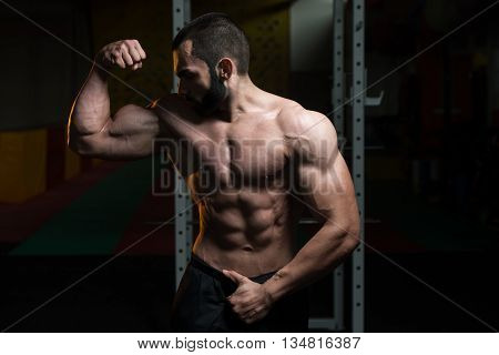 Young Bodybuilder Flexing Muscles Double Biceps Pose
