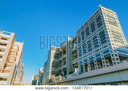 TOKYO JAPAN - NOVEMBER 27 2015: Fuji T.V. headquarters one of the most striking buildings in Japan. its' futuristic metallic clad building featuring a massive silver ball 32 metres in diameter