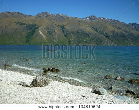 Lake Wakatipu in the Otago mountains on a clear day