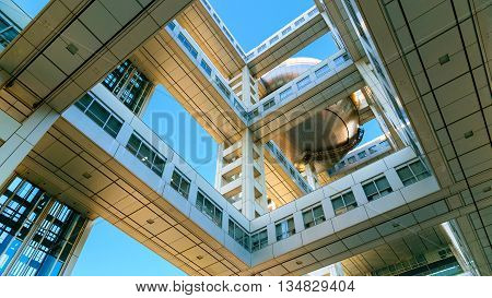 TOKYO JAPAN - NOVEMBER 27 2015: Fuji T.V. headquarters one of the most striking buildings in Japan. its' futuristic metallic clad building featuring a massive silver ball 32 metres in diameter