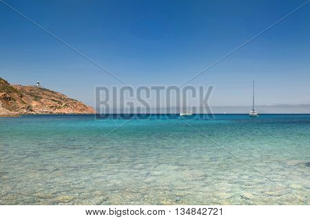 beautiful sea with sailing at horizon in Corsica Revellata