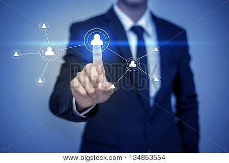 Close up of businessman touching digital screen with finger