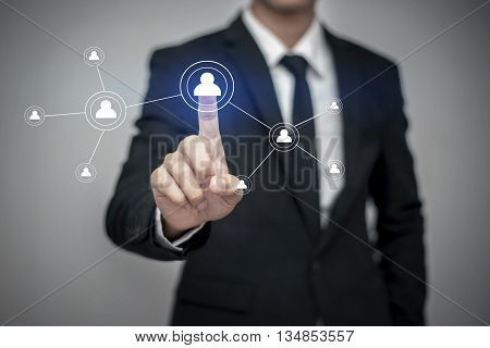 Close up of businessman touching digital screen with finger