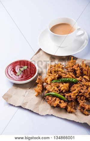 Samosa snack with tomato ketchup and hot tea, Fresh samosas with ketchup and hot chai ready for breakfast