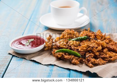Samosa snack with tomato ketchup and hot tea, Fresh samosas with ketchup and hot chai ready for breakfast