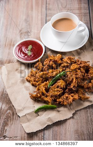 Samosa snack with tomato ketchup and hot tea, Fresh samosas with ketchup and hot chai ready for breakfast