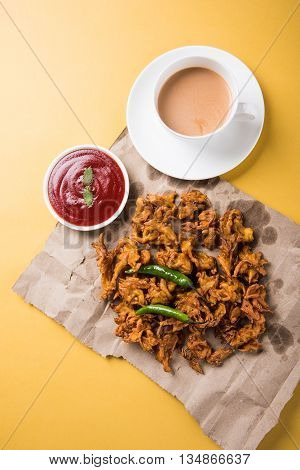 Samosa snack with tomato ketchup and hot tea, Fresh samosas with ketchup and hot chai ready for breakfast