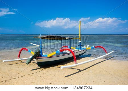Traditional Balinese boat on a Sanur beach in Bali, Indonesia