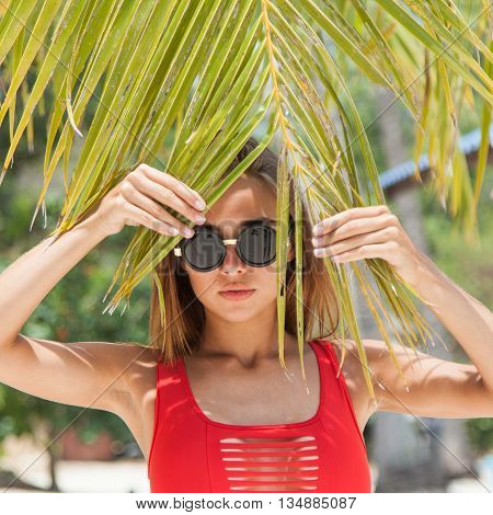 Woman on the beach in the red swimwear