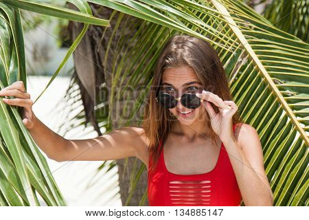 Woman on the beach in the red swimwear