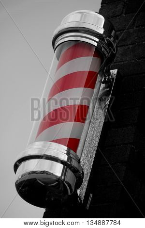 Abstract Barbers shop sign Black & White with a touch of colour.Dorset England