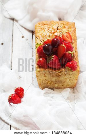 Fruitcake With Strawberry And Cherry Topping