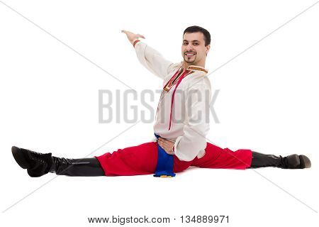 young man wearing a folk costume posing against isolated white background with copyspace