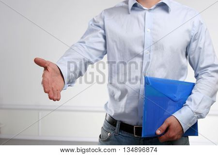 Business man offering his hand for handshake.