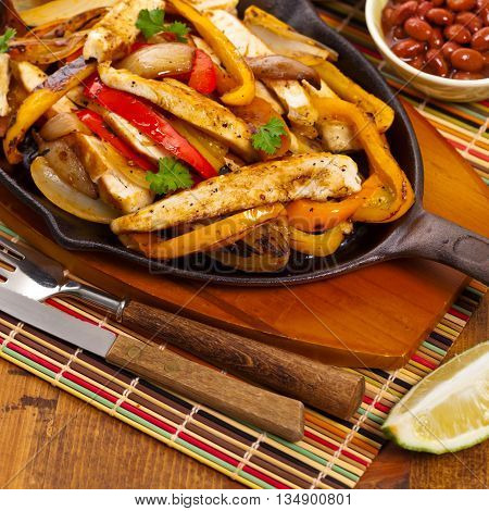 Chicken Fajitas with Grilled Onions and Bell Peppers. Selective focus.