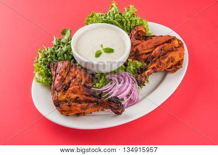 tandoori chicken leg, Tandoori Chicken , Indian spicy food, Delicious Tandoori chicken leg piece with Salad, India