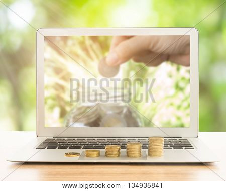 stack of gold coins on laptop computer. concept of business growth development investment growth investment concept growth concept.