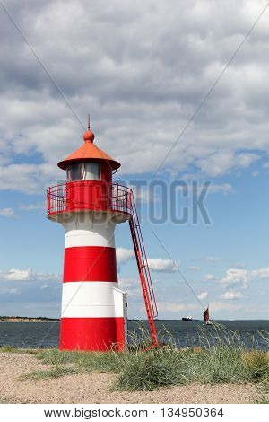The white and red lighthouse of Oddesund in Denmark