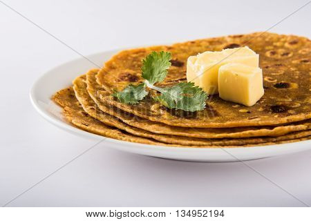 Hot delicious paratha with ghee on white