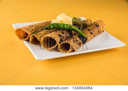 Hot delicious paratha with ghee, green chilly, coriander and tomato sauce. Paratha Rolls. Chapati made using indian spices. Kolkata rolls