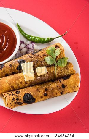 Hot delicious paratha with ghee, green chilly, coriander and tomato sauce. Paratha Rolls. Chapati made using indian spices. Kolkata rolls