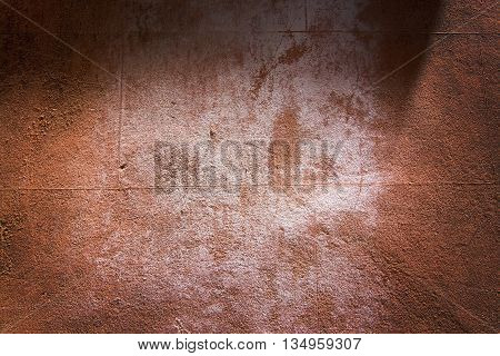 Red terra-cotta grungy roughcast horizontal background texture closeup.