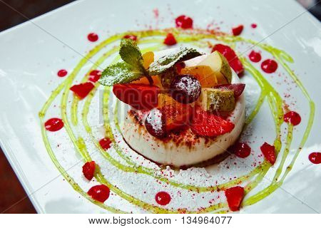 Photo Of Italian Panna Cotta Dessert With Strawberry Sirup And Mint Leaf
