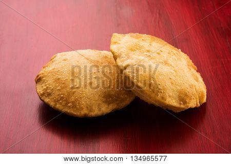 indian puri or poori or fried roti or bhatura, isolated