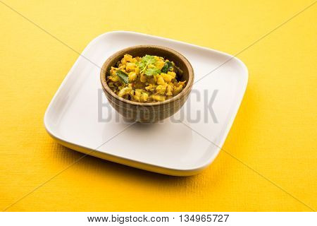 indian semi dry potato spicy recipe also known as aalu bhaji or aalu sabji or dry potato curry