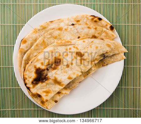 Homemade Indian Naan Flatbread made with Whole Wheat, plain indian roti, plain tandoori roti