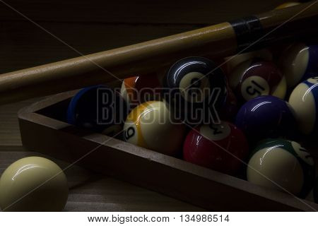portrait of set of biliard balls illuminated with light paint technique