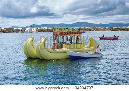 Traditional Village On Floating Islands On Lake Titicaca In Peru, South America